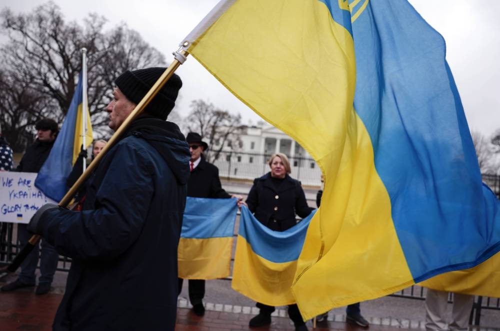 Anti-war demonstrators and Ukrainians living in the US protest against Russia's military operation in Ukraine in Lafayette Park in Washington, DC, on Feb 24, 2022. - AFP