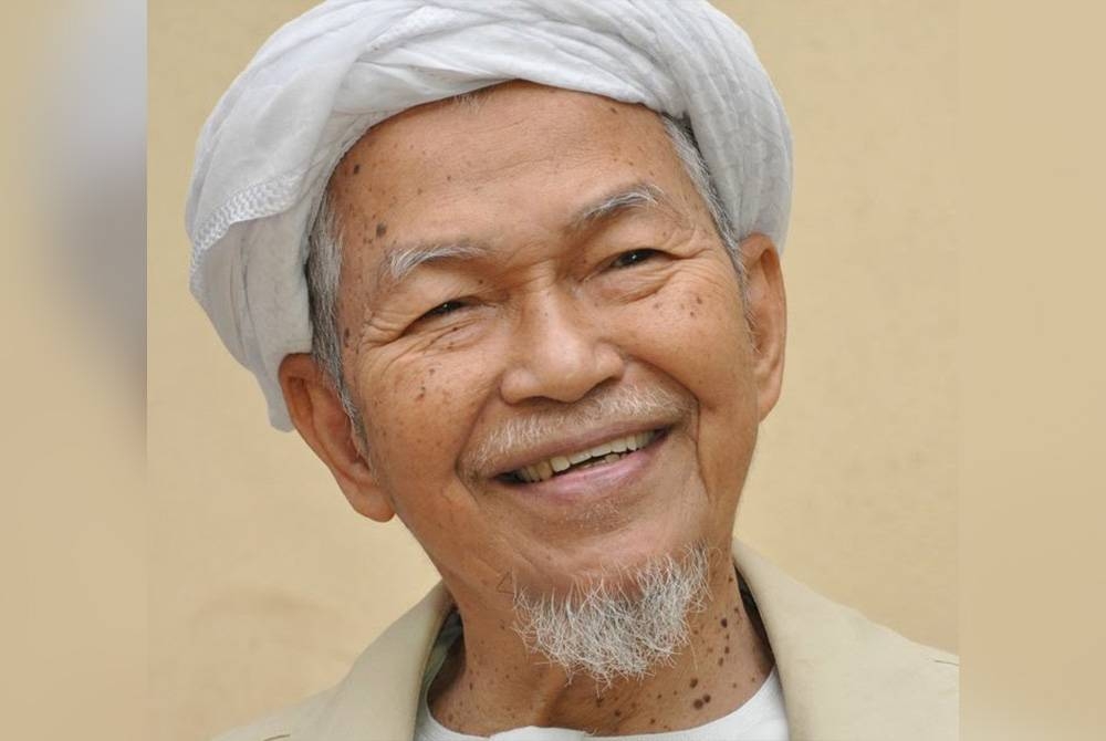 The late Nik Abdul Aziz conferred the Panglima Setia Mahkota (PSM) award which carries the title 'Tan Sri'. FILE PIX