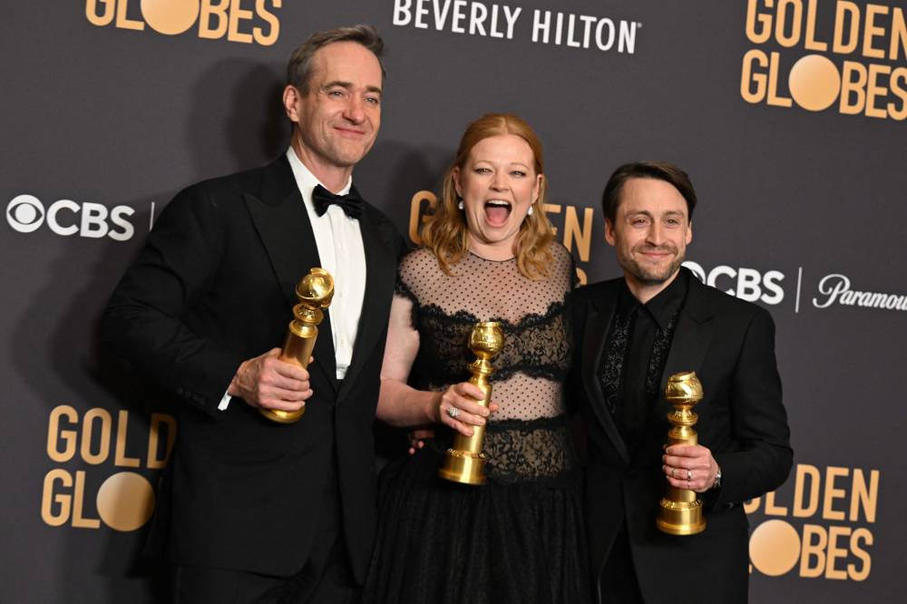 (L-R) English actor Matthew Macfayden poses with the award for Best Performance by a Male Actor in a Supporting Role on Television for