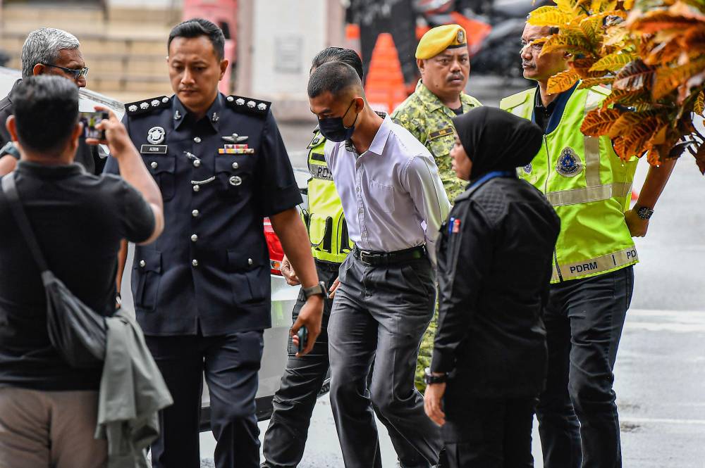 Amirul Iskandar Norhanizan was charged with committing the offence to Muhammad Salman Mohd Saiful Surash. - Photo by Bernama