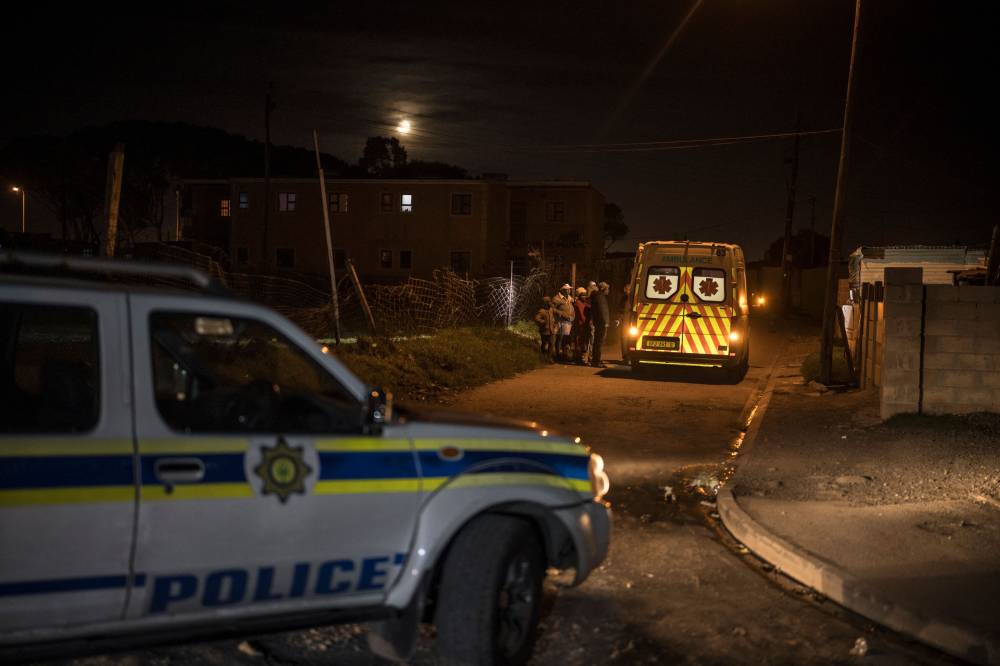 A patrol car of the South African Police Service provides escort to an ambulance with the Southern Division paramedic at Mitchells Plain EMS base intervening during a night shift duty in the Philippi township, Cape Town, within the broader Cape Flats area, on April 15, 2025. Cape Town’s Emergency Medical Services (EMS) refuses to allow its medical crews to move without security cover when they operate in Red Zones.
(Photo by MARCO LONGARI/AFP)