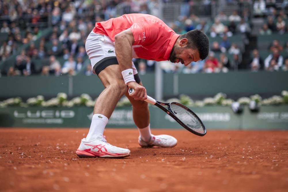 Serbia's Novak Djokovic reacts during his match against Hungary's Marton Fucsovics at the ATP 250 Geneva Open tennis tournament in Geneva on May 21, 2025. (Photo by FABRICE COFFRINI / AFP)